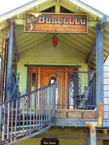 Sign says, "Fine Tobacco, Whiskey and Women." Well now! Is there anything else you might need, sir?